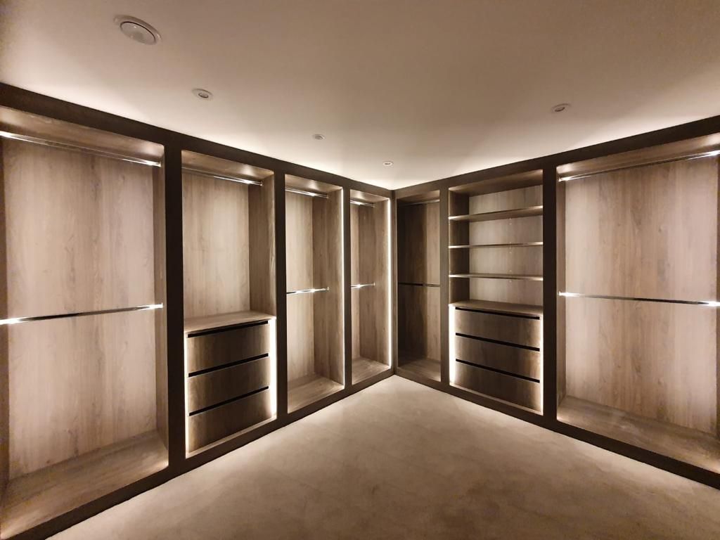 Dressing room with lit open shelving